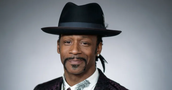 Katt Williams Net Worth Explained: How He Built—and Lost—Millions Katt Williams net worth - Comedian wearing signature black fedora and patterned suit jacket smiling confidently