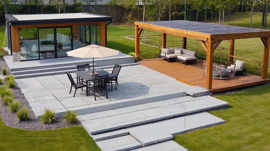 Backyard outdoor living space with composite deck, stone patio, and pergola seating area
